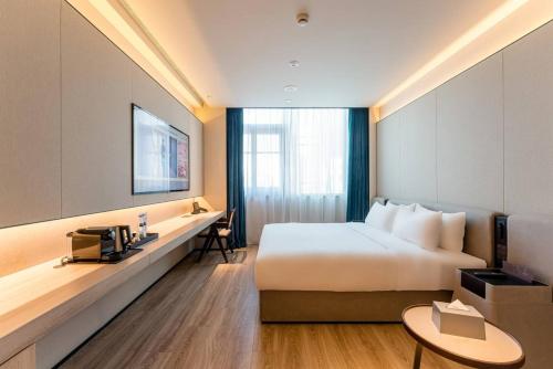Imagen de la habitación del Hotel Orange Crystal Shanghai Bund North Sichuan Road. Foto 16