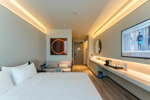 Imagen de la habitación del Hotel Orange Crystal Shanghai Bund North Sichuan Road. Foto 17