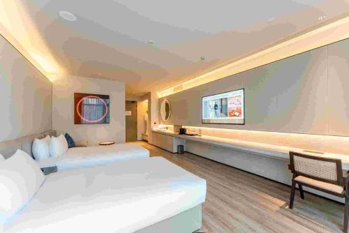 Imagen de la habitación del Hotel Orange Crystal Shanghai Bund North Sichuan Road. Foto 19