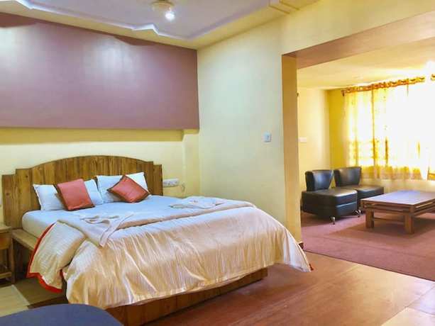 Imagen de la habitación del Hotel Orange Inn, Ahmedabad. Foto 7