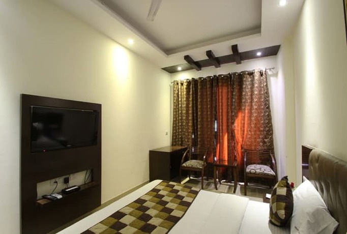 Imagen de la habitación del Hotel Orange Inn, Ahmedabad. Foto 11