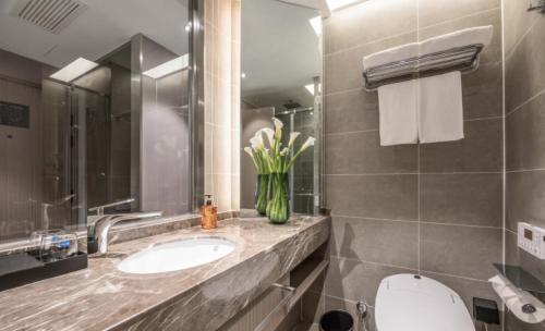 Imagen general del Hotel Orange - Taicang Nanyang Plaza. Foto 4