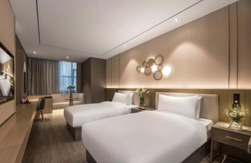 Imagen general del Hotel Orange - Taicang Nanyang Plaza. Foto 12