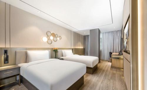 Imagen de la habitación del Hotel Orange - Taicang Nanyang Plaza. Foto 20