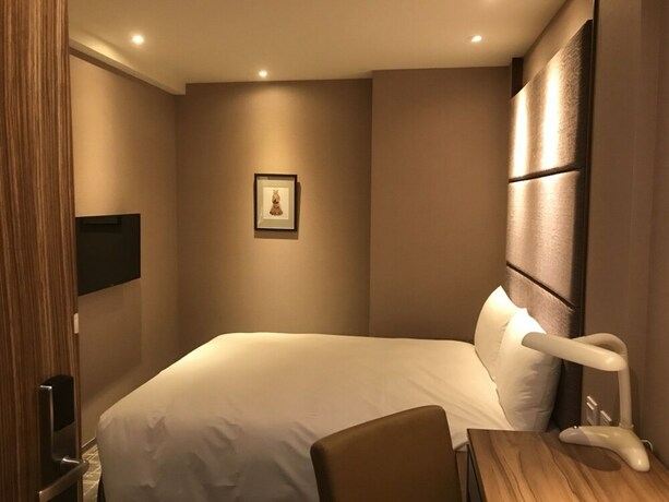 Imagen de la habitación del Hotel Orange - Wenhua. Foto 17