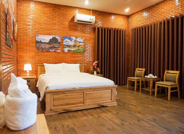 Imagen de la habitación del Hotel Orchard Home Resort Nam Cat Tien. Foto 5
