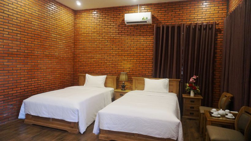 Imagen de la habitación del Hotel Orchard Home Resort Nam Cat Tien. Foto 7