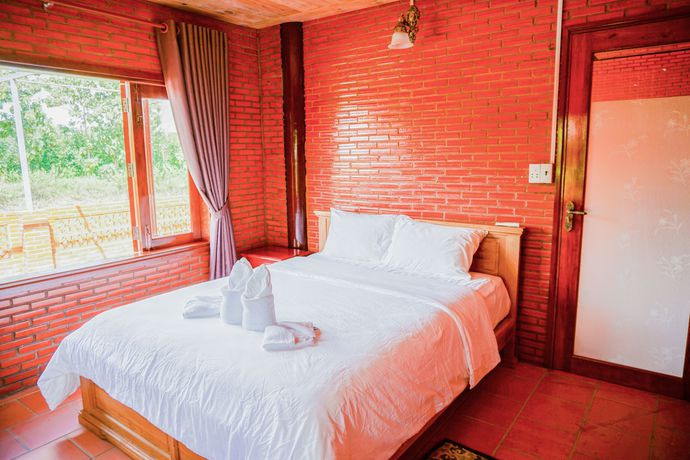 Imagen de la habitación del Hotel Orchard Home Resort Nam Cat Tien. Foto 8