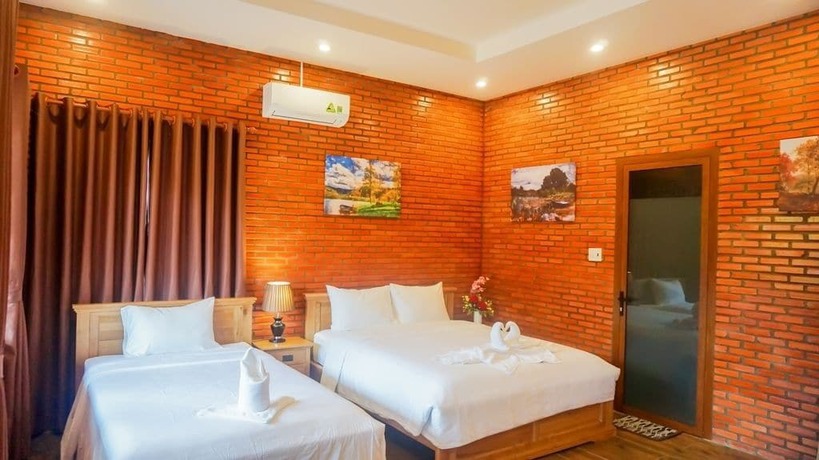 Imagen de la habitación del Hotel Orchard Home Resort Nam Cat Tien. Foto 9
