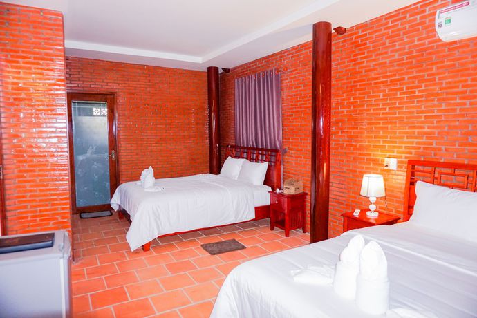 Imagen de la habitación del Hotel Orchard Home Resort Nam Cat Tien. Foto 13