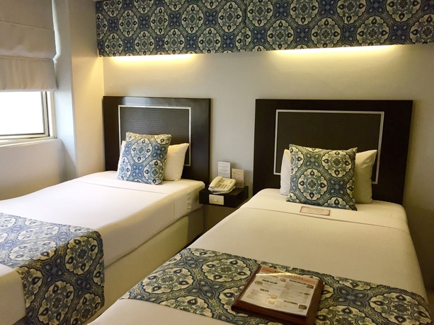 Imagen de la habitación del Hotel Orchid Garden Suites. Foto 10