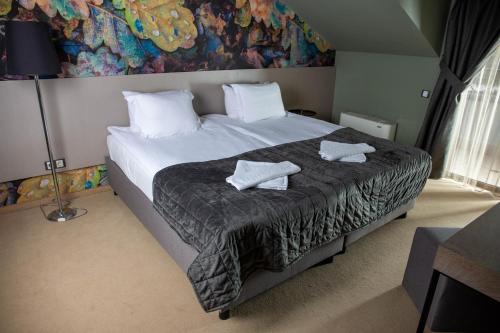 Imagen de la habitación del Hotel Ores Boutique. Foto 18