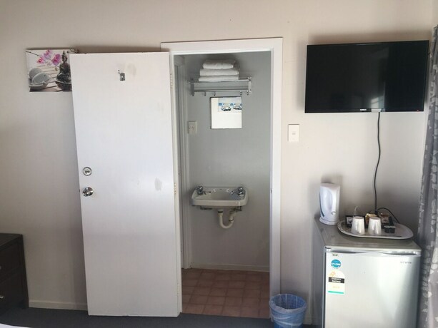 Imagen de la habitación del Hotel Orewa Pillows Lodge. Foto 28