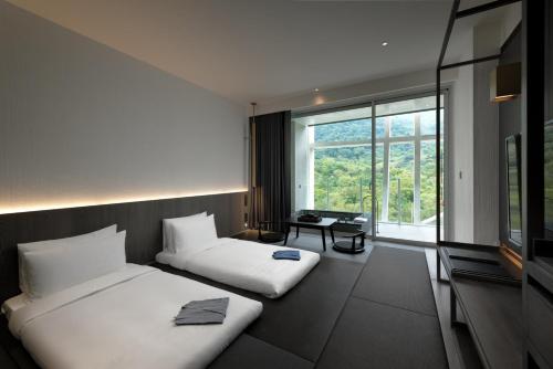 Imagen de la habitación del Hotel Orient Luxury-Jiaoxi. Foto 12