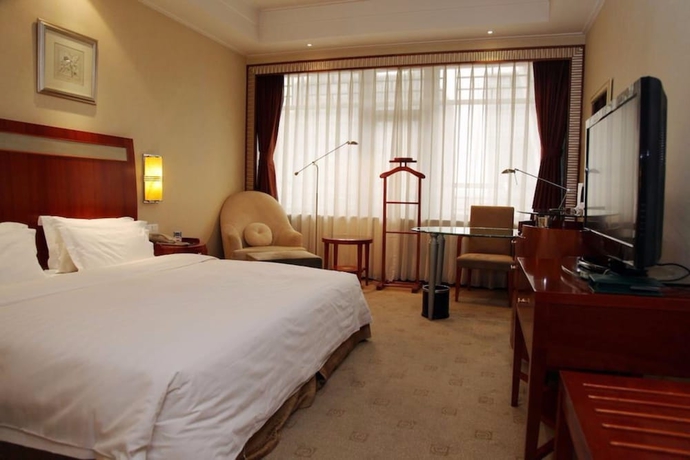 Imagen de la habitación del Hotel Oriental Garden. Foto 9