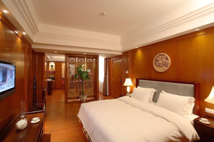 Imagen de la habitación del Hotel Oriental Garden. Foto 13