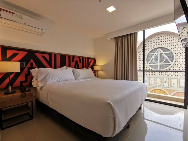 Imagen de la habitación del Hotel Origen Local Suites. Foto 18