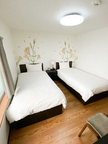 Imagen de la habitación del Hotel Osaka Nipponbashi Family House. Foto 33