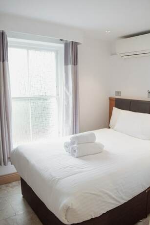 Imagen de la habitación del Hotel Osborne Apartments. Foto 18