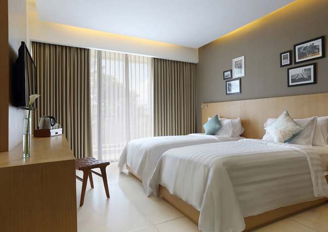 Imagen de la habitación del Hotel Ossotel Legian Bali. Foto 2