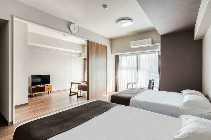 Imagen de la habitación del Hotel Ostay Shin-osaka Apartment. Foto 8