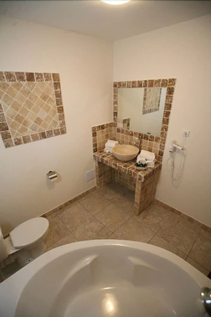 Imagen de la habitación del Hotel Osteria A Stalla Sischese. Foto 19