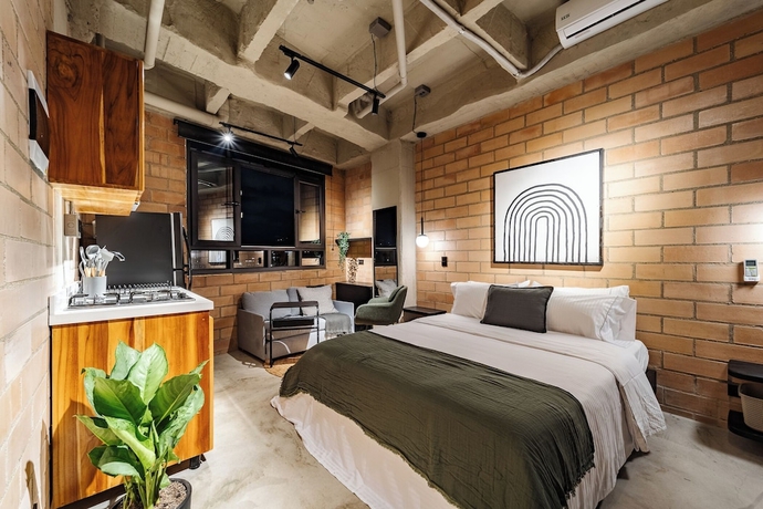 Imagen de la habitación del Hotel Otalu Suites. Foto 2