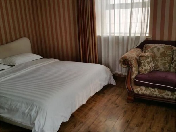 Imagen de la habitación del Hotel Ou Lu Business. Foto 5