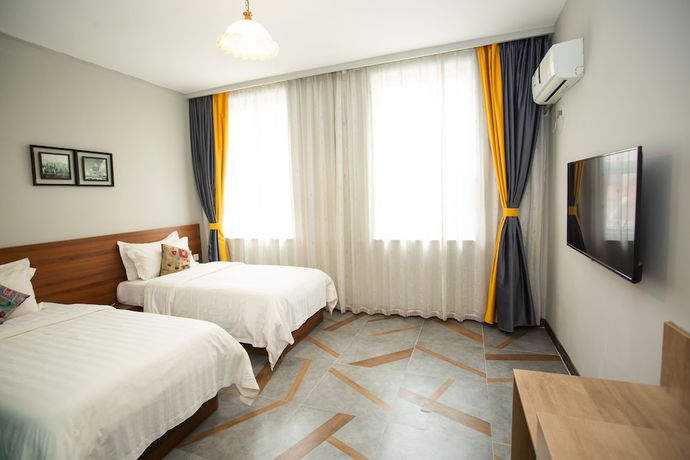 Imagen de la habitación del Hotel Ou Lu Business. Foto 13