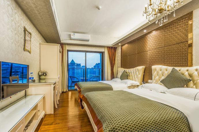 Imagen de la habitación del Hotel Ou Shu Ge Apartment. Foto 11