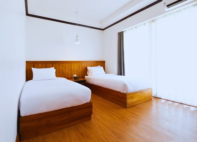 Imagen de la habitación del Hotel Oudomsin Vangvieng. Foto 16