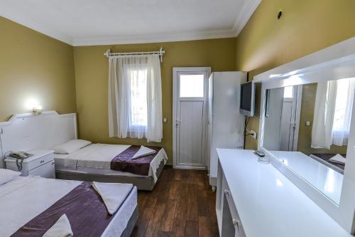 Imagen de la habitación del Hotel &Ouml;l&uuml;deniz Manzara. Foto 18