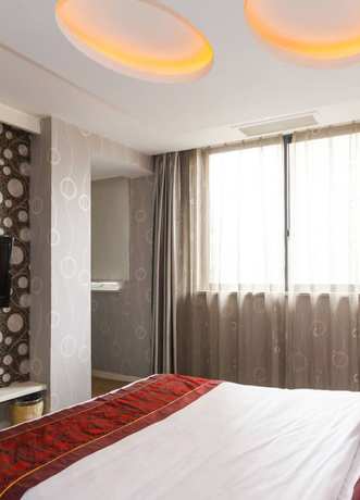 Imagen de la habitación del Hotel Oushang Fengqing. Foto 14