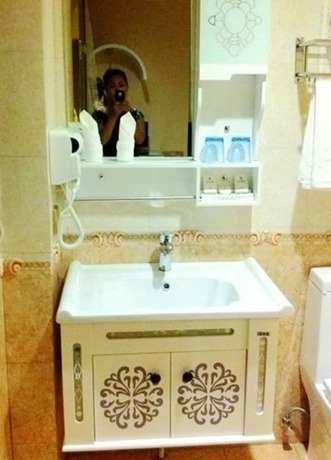 Imagen de la habitación del Hotel Oushang Fengqing. Foto 16