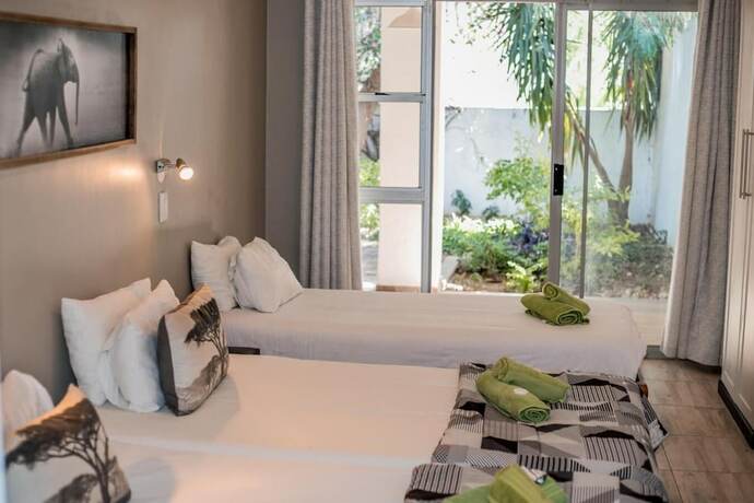 Imagen de la habitación del Hotel Out of Africa Guest House. Foto 19