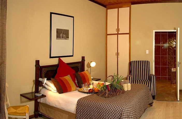 Imagen de la habitación del Hotel Out of Africa Town Lodge. Foto 6