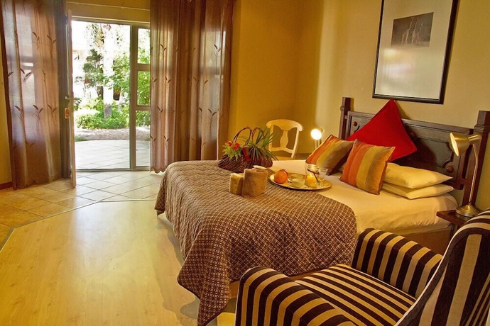 Imagen de la habitación del Hotel Out of Africa Town Lodge. Foto 10