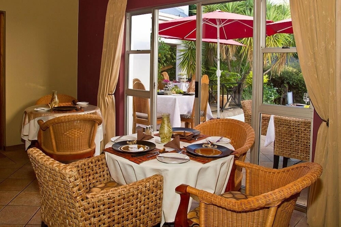 Imagen del bar/restaurante del Hotel Out of Africa Town Lodge. Foto 4