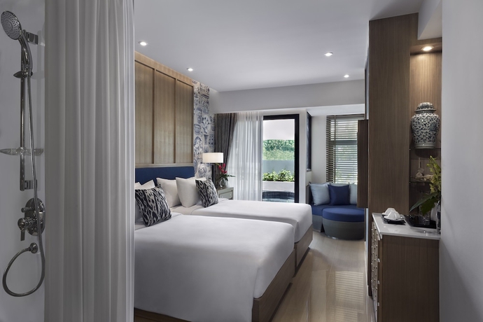 Imagen de la habitación del Hotel Outrigger Surin Beach Resort. Foto 4