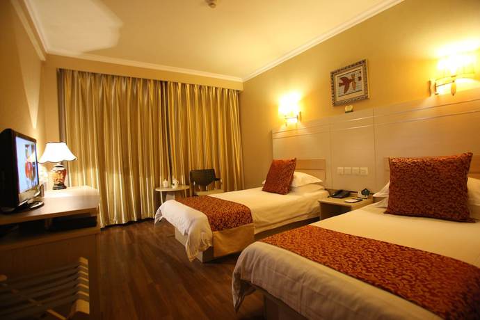 Imagen de la habitación del Hotel Overseas Chinese International. Foto 3