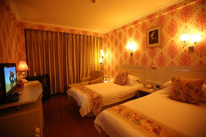 Imagen de la habitación del Hotel Overseas Chinese International. Foto 6