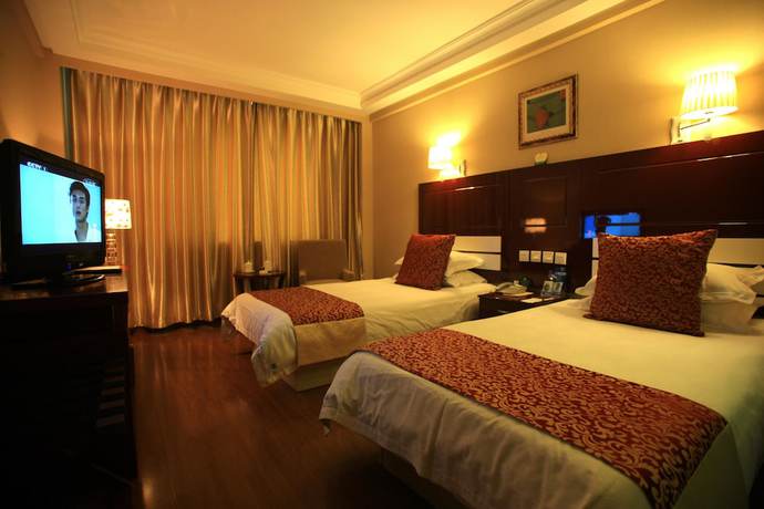 Imagen de la habitación del Hotel Overseas Chinese International. Foto 8