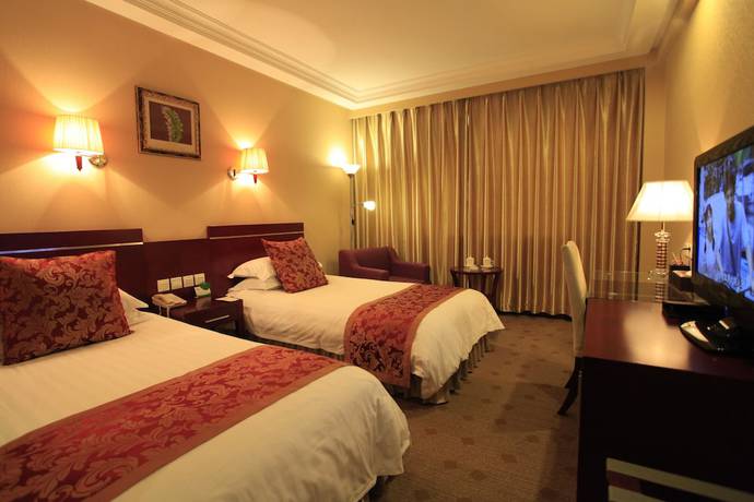 Imagen de la habitación del Hotel Overseas Chinese International. Foto 10