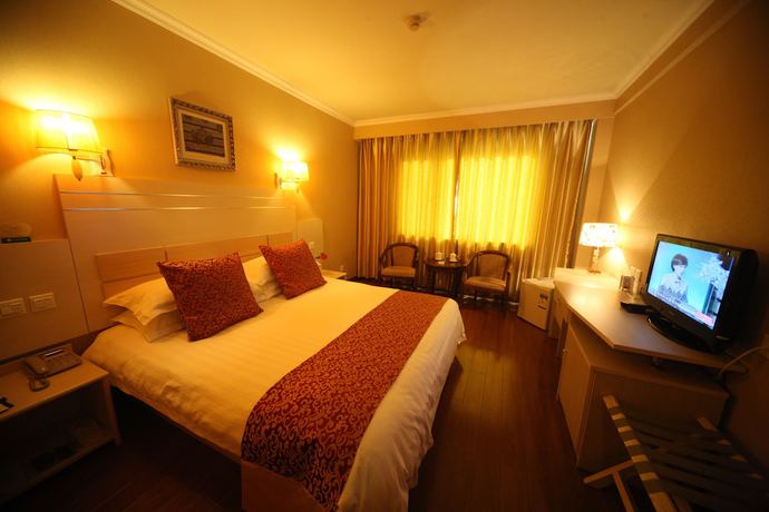 Imagen de la habitación del Hotel Overseas Chinese International. Foto 11