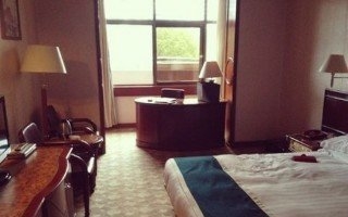 Imagen de la habitación del Hotel Overseas Chinese, Shangcheng District. Foto 9