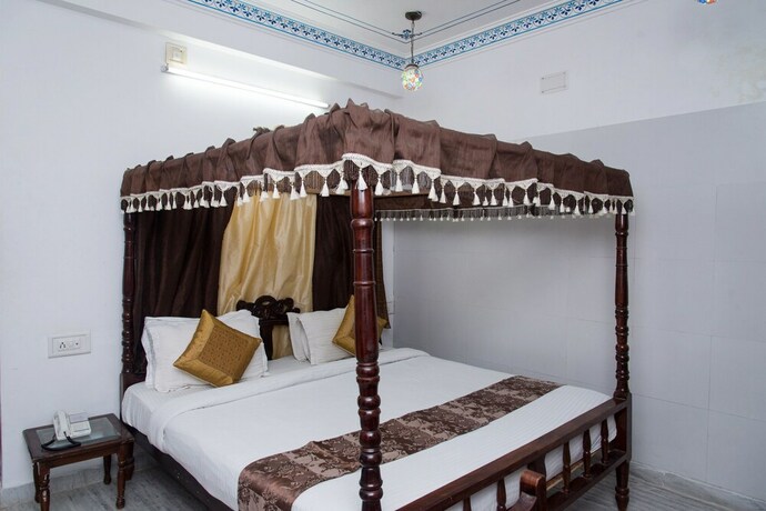 Imagen de la habitación del Hotel Oyo 10319 Pichola Haveli. Foto 12
