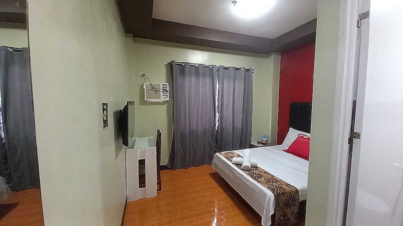 Imagen de la habitación del Hotel Oyo 1037 Lendes Tourist Inn Main. Foto 5
