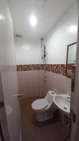 Imagen de la habitación del Hotel Oyo 1037 Lendes Tourist Inn Main. Foto 7