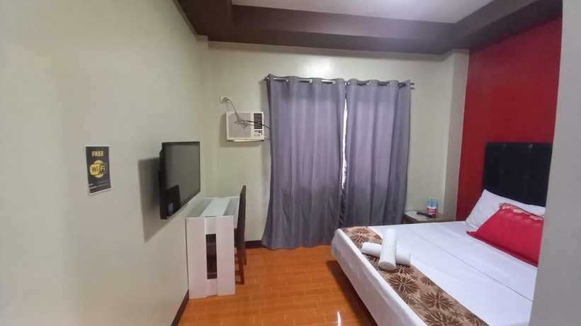 Imagen de la habitación del Hotel Oyo 1037 Lendes Tourist Inn Main. Foto 9