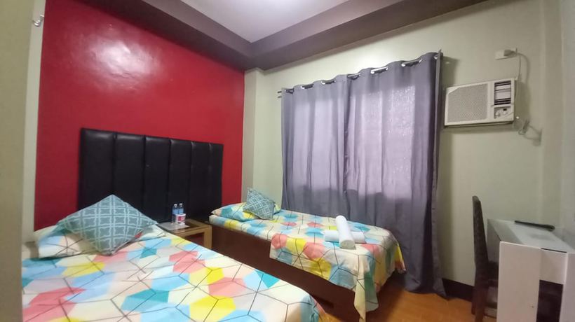 Imagen de la habitación del Hotel Oyo 1037 Lendes Tourist Inn Main. Foto 10